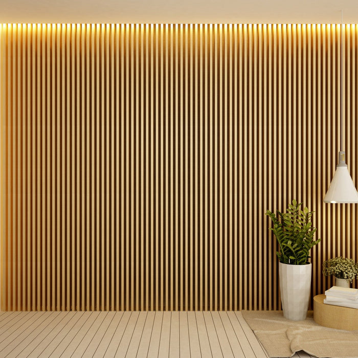 Modern living space with vertical wood slat feature wall, warm ceiling lighting, and a cozy reading corner with wooden chair and indoor plants.