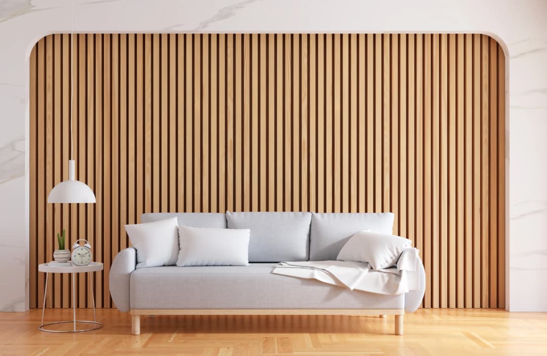 Greige, a blend of gray and beige sofa and golden oak wood floor paneling