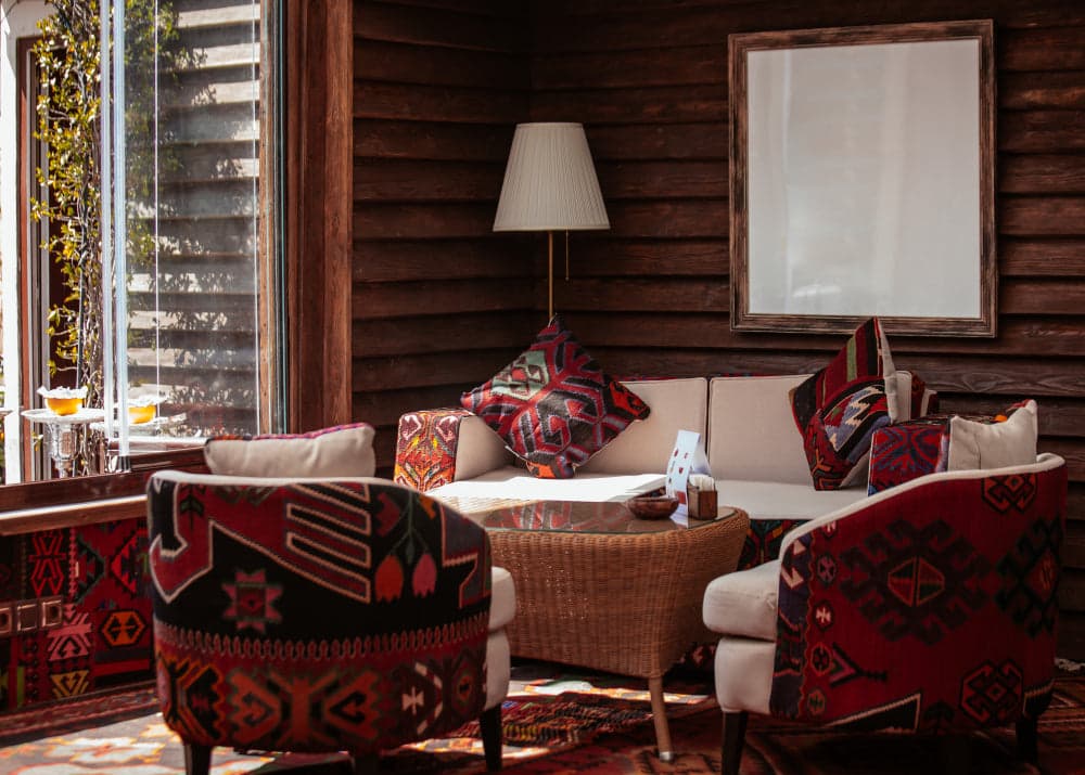 Living room in Americana interior design with muted red, denim blue, and farmhouse white for a cozy vintage feel.