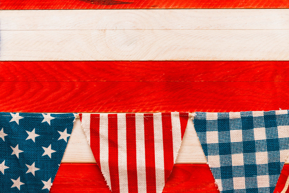 Americana theme decor with framed vintage flag, patchwork quilts, and subtle star motifs for heritage-inspired interiors.
