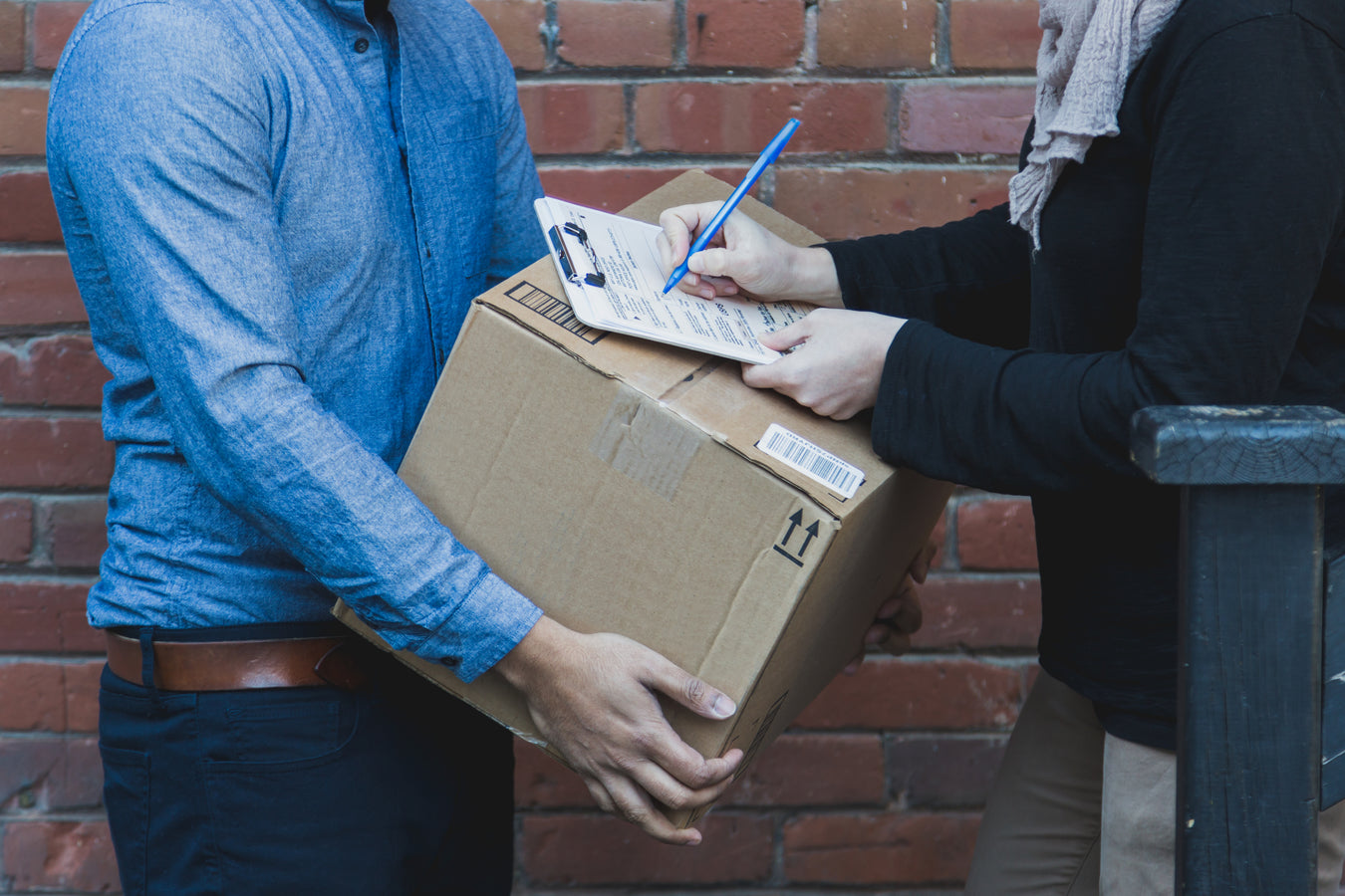 man-signing-for-shipping-box-The Panel Hub